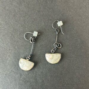 Earrings with white stone.